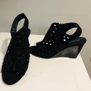 Black high heel wedges side zipper peep toe and all around a pick a boo look.